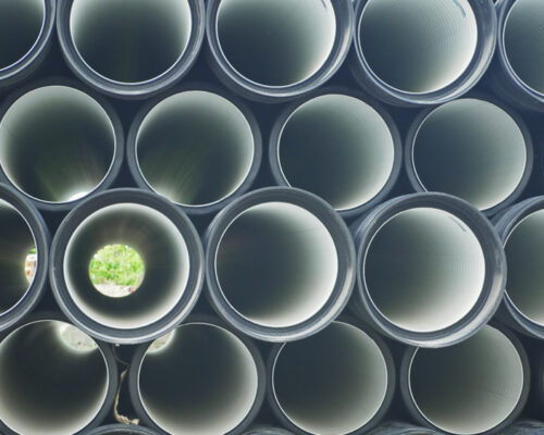 Warehouse,Of,Finished,Plastic,Pipes,Industrial,Outdoors,Storage,Site.,Manufacture