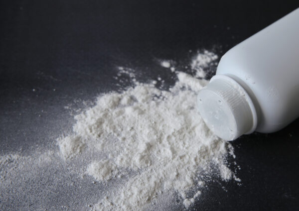 Talcum,Powder,On,Black,Background